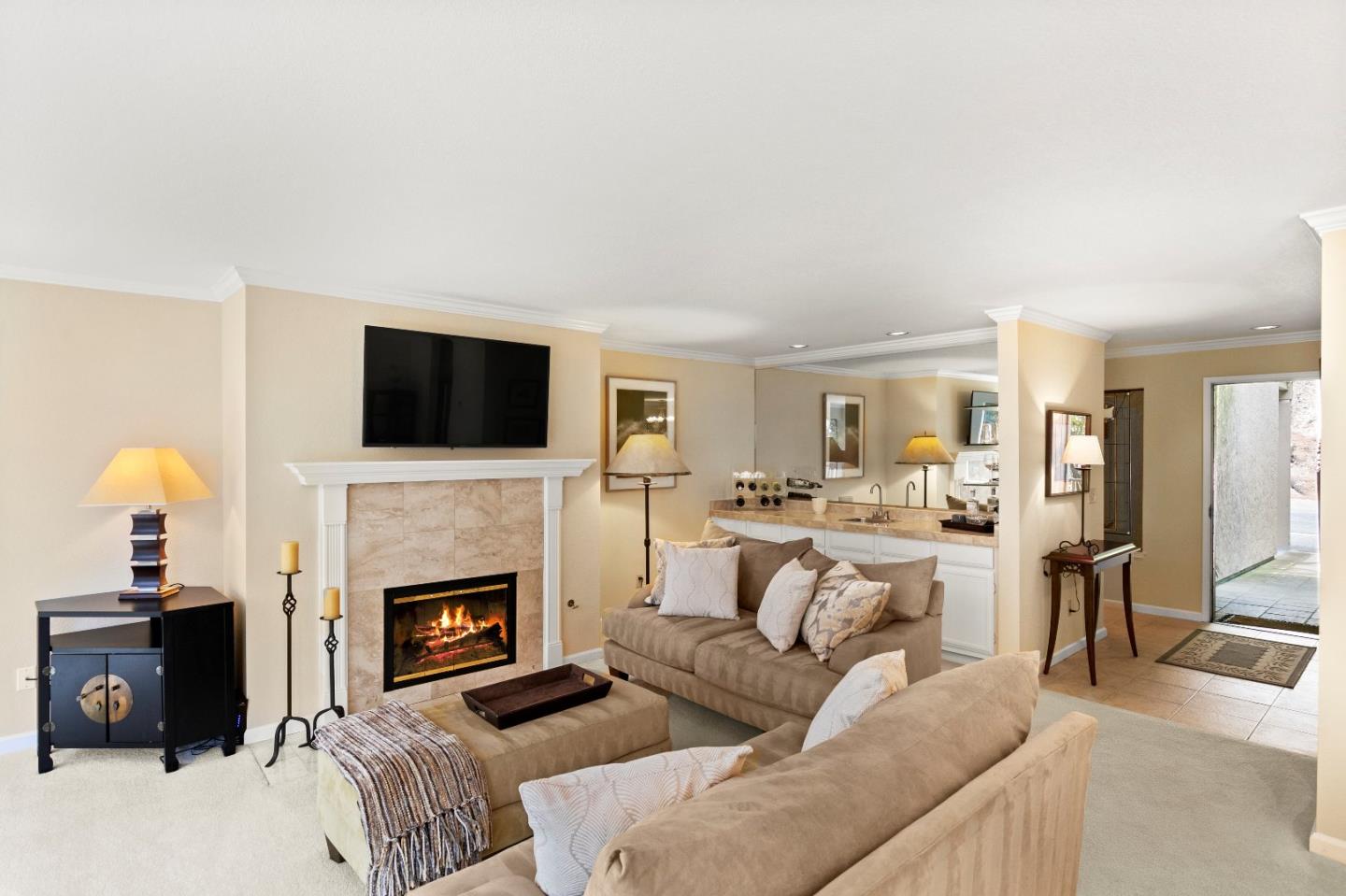 51 Shepherds Knoll Road, Unit 51 Monterey, CA 93940 - Photo 7 of 18 a living room with furniture a fireplace and a flat screen tv