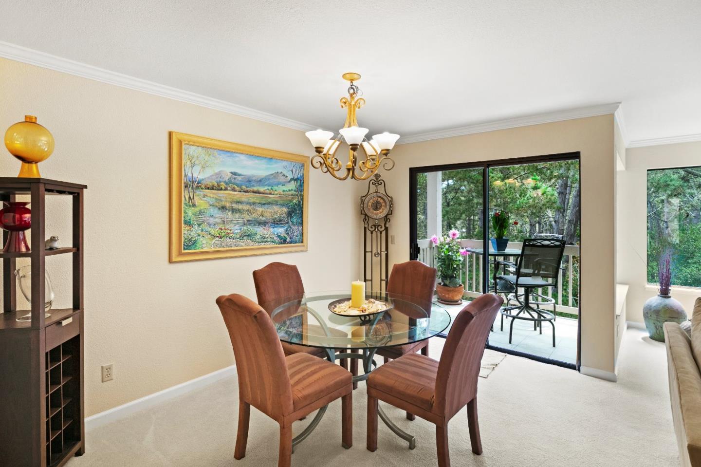 51 Shepherds Knoll Road, Unit 51 Monterey, CA 93940 - Photo 8 of 18 a dining room with furniture a large window and a chandelier