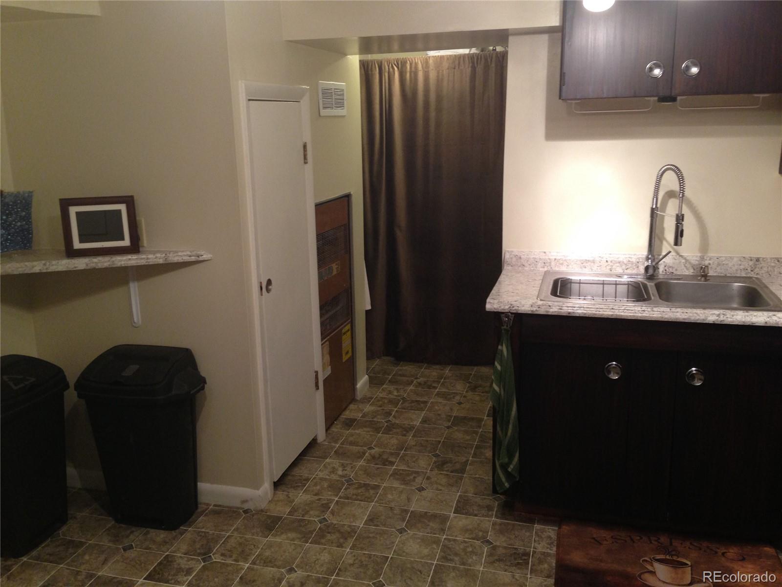 Undisclosed Address Denver, CO 80210 - Photo 11 of 31 a kitchen with stainless steel appliances granite countertop a refrigerator and a sink