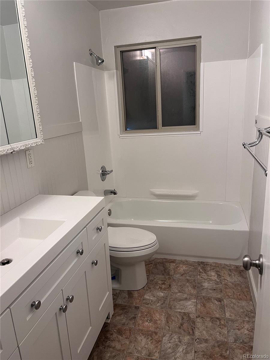 Undisclosed Address Denver, CO 80210 - Photo 17 of 31 a bathroom with a granite countertop sink toilet and shower