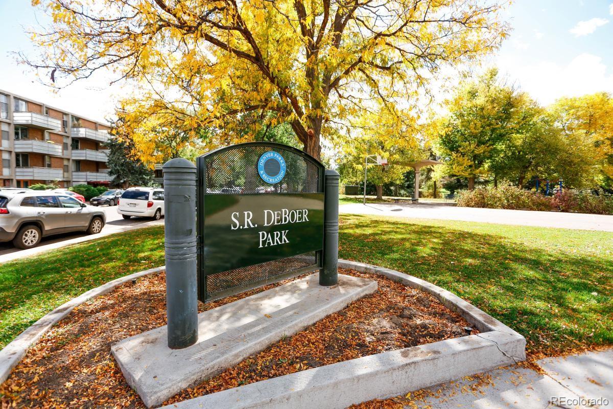 Undisclosed Address Denver, CO 80210 - Photo 6 of 31 a view of a street with a bench and sign board