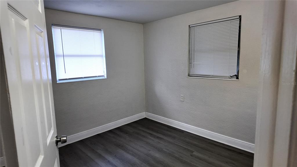 37530 Ferris Avenue Zephyrhills, FL 33542 - Photo 12 of 17 an empty room with a window