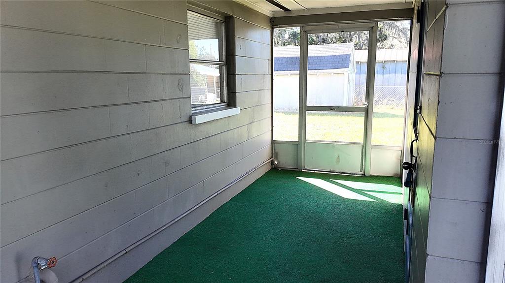 37530 Ferris Avenue Zephyrhills, FL 33542 - Photo 14 of 17 a view of an empty room with a window