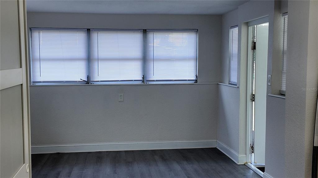 37530 Ferris Avenue Zephyrhills, FL 33542 - Photo 8 of 17 a view of an empty room with a window