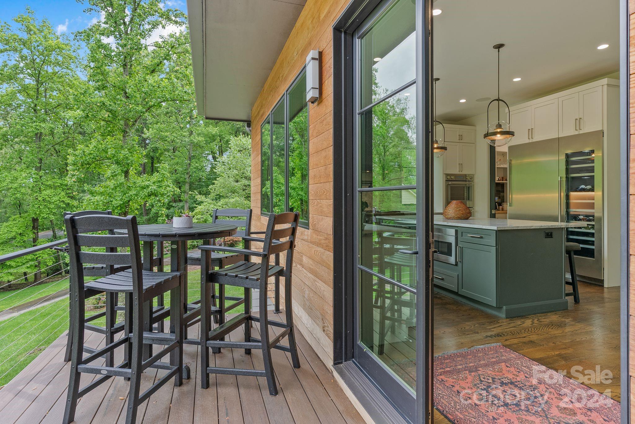 38 Brookwood Road Asheville, NC 28804 - Photo 11 of 45 a view of a dining room with furniture window and wooden floor