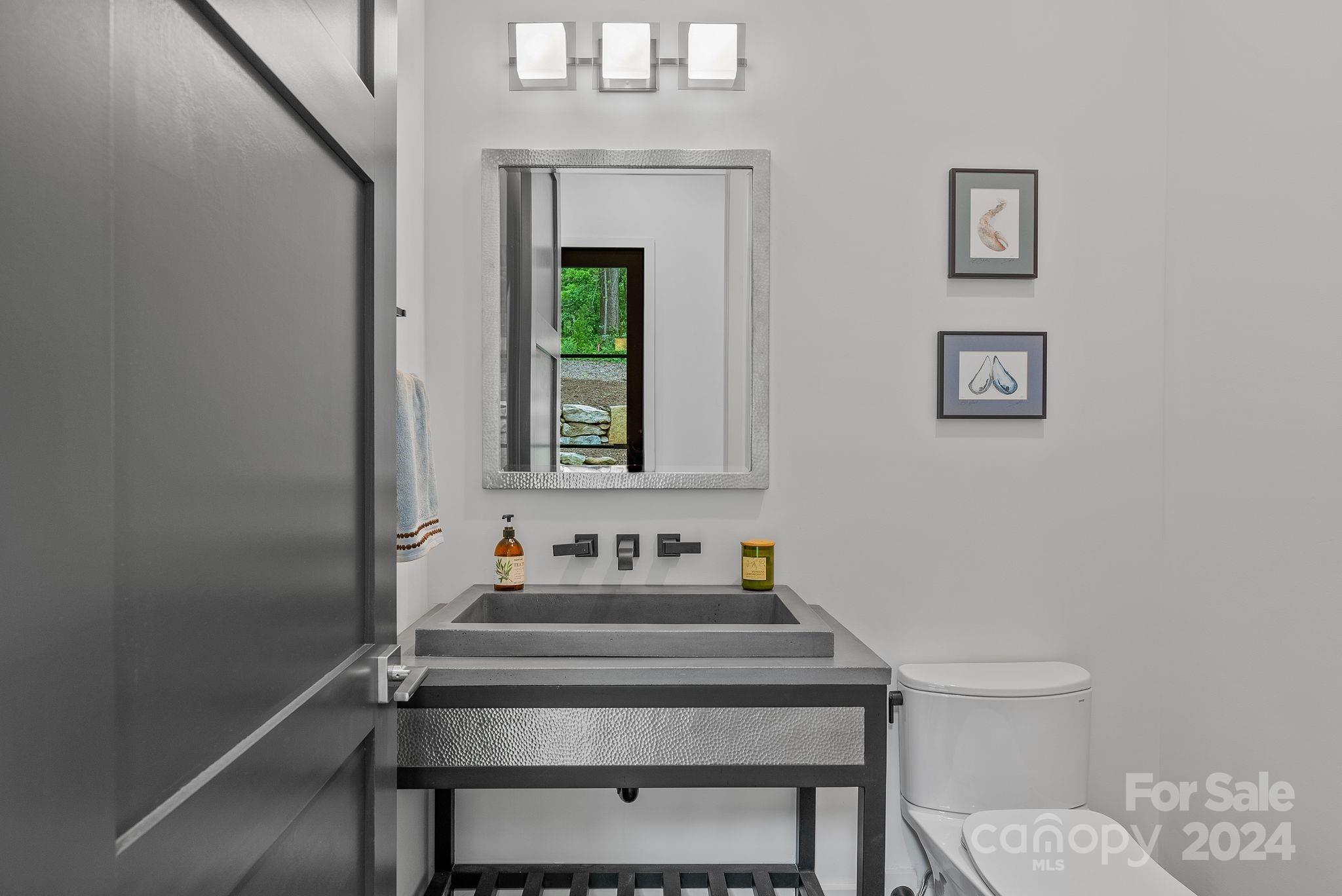 38 Brookwood Road Asheville, NC 28804 - Photo 12 of 45 a bathroom with a sink toilet and a mirror