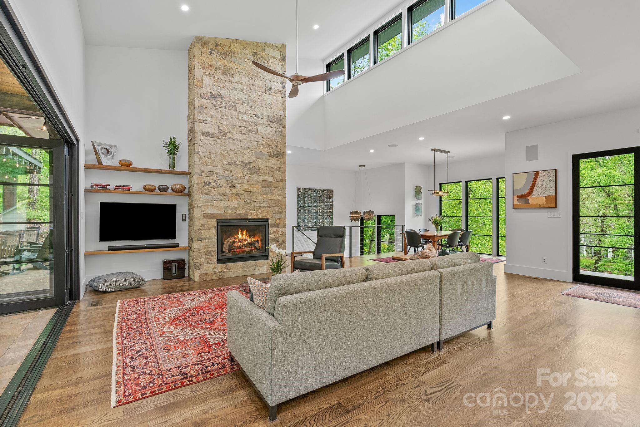38 Brookwood Road Asheville, NC 28804 - Photo 13 of 45 a living room with furniture fireplace and flat screen tv