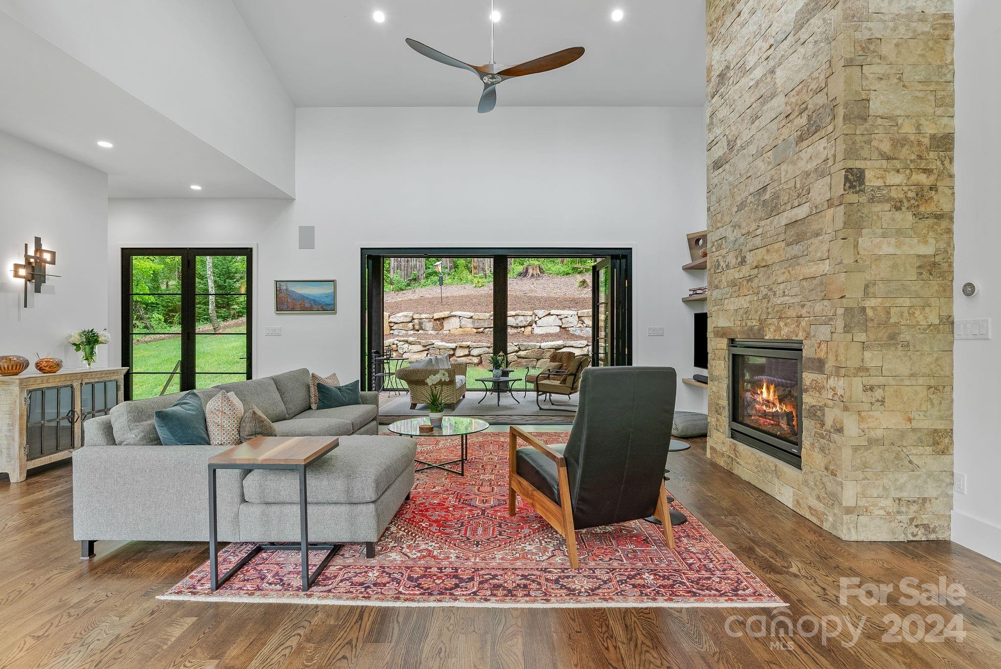 38 Brookwood Road Asheville, NC 28804 - Photo 18 of 45 a living room with furniture and a fireplace