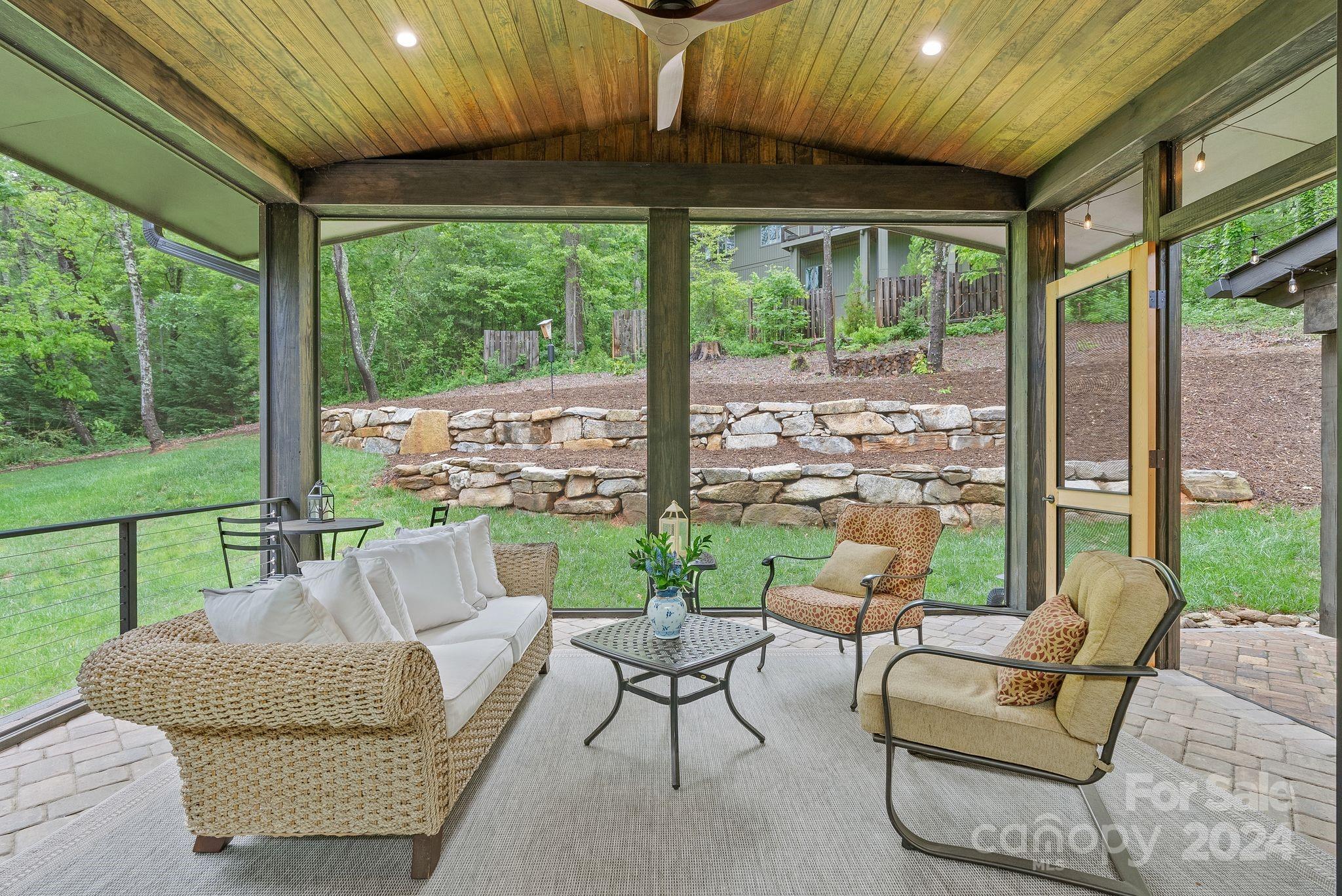 38 Brookwood Road Asheville, NC 28804 - Photo 20 of 45 a balcony with furniture and a garden