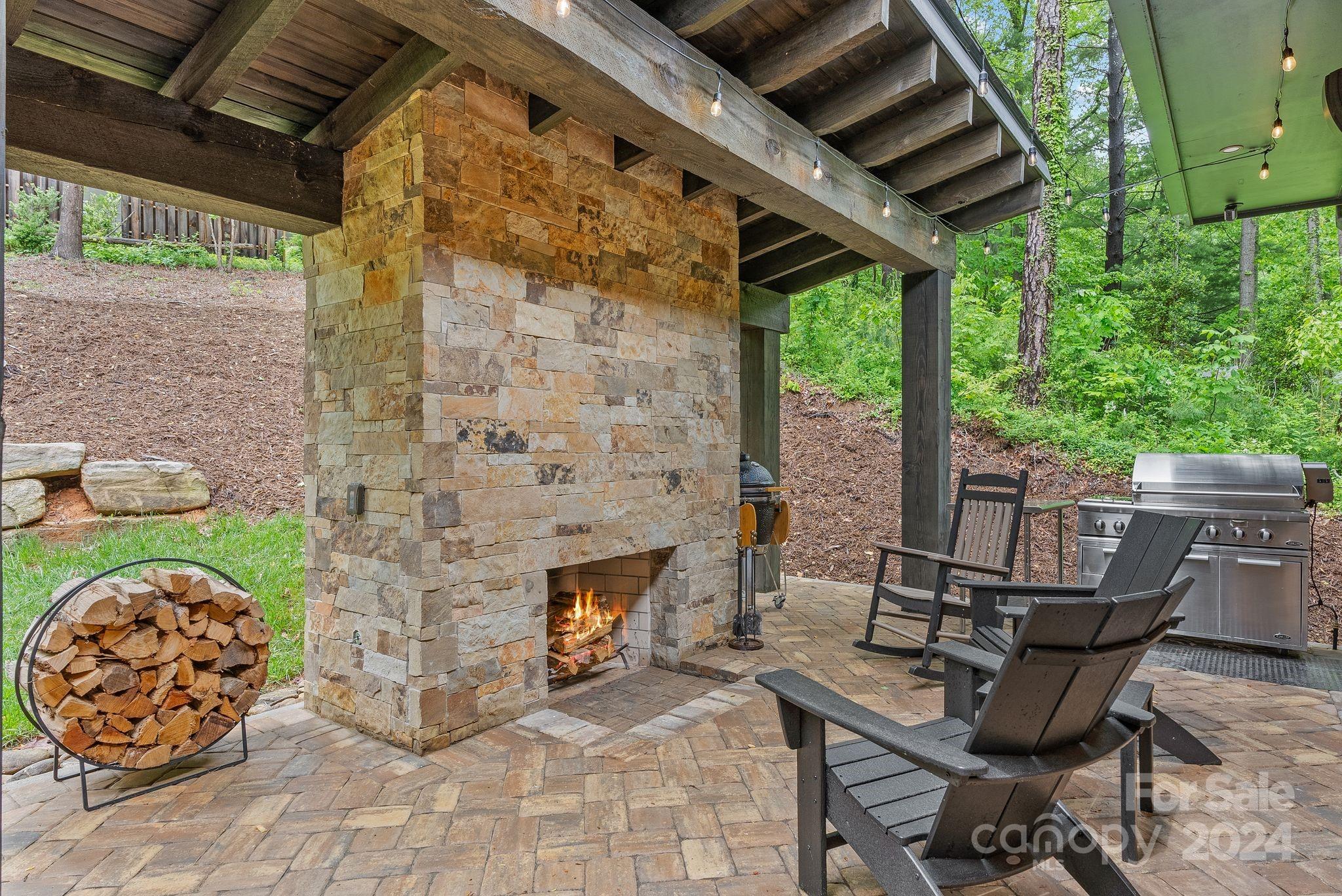 38 Brookwood Road Asheville, NC 28804 - Photo 24 of 45 a patio with table and chairs and potted plants