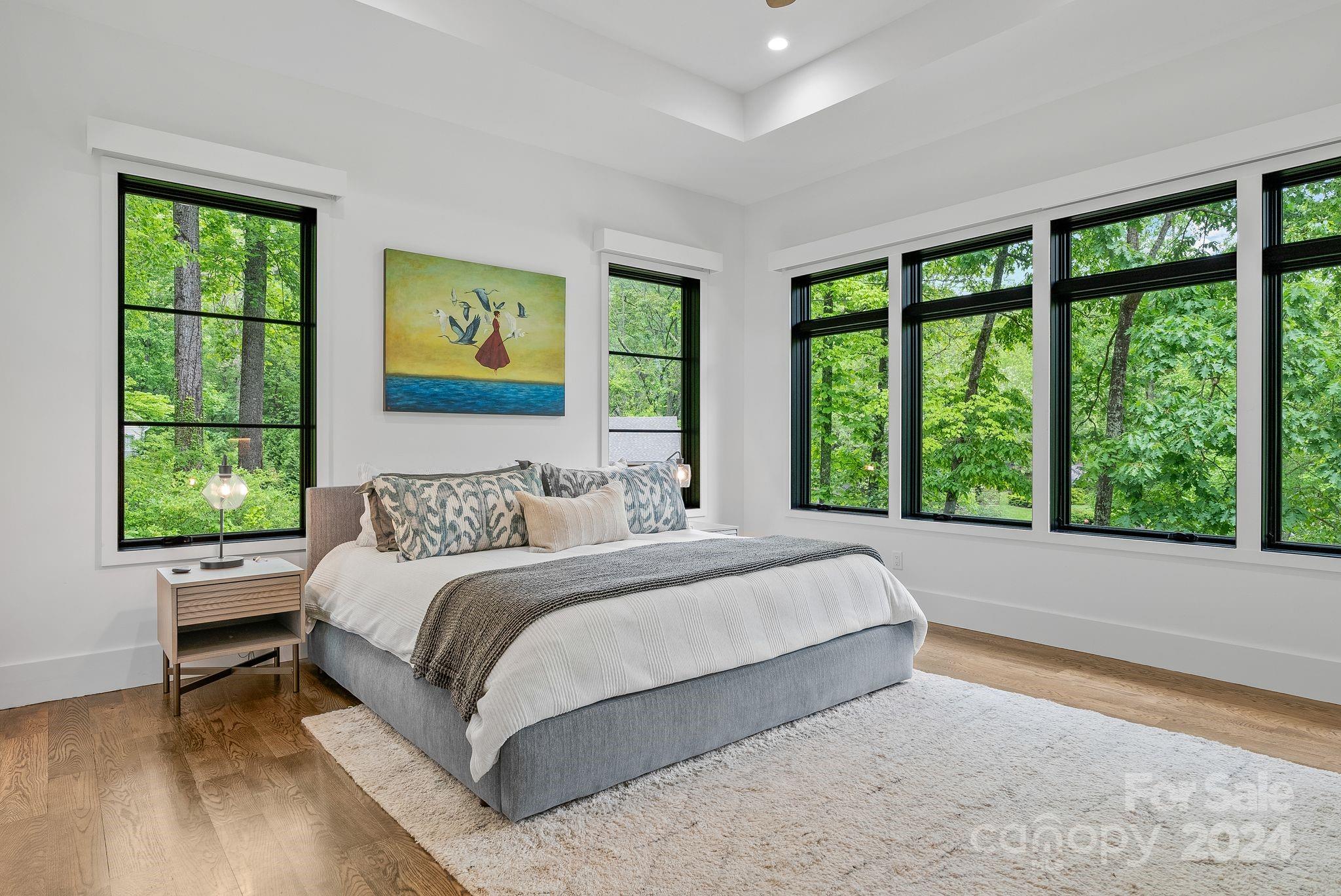 38 Brookwood Road Asheville, NC 28804 - Photo 29 of 45 a bedroom with a large bed and a large window
