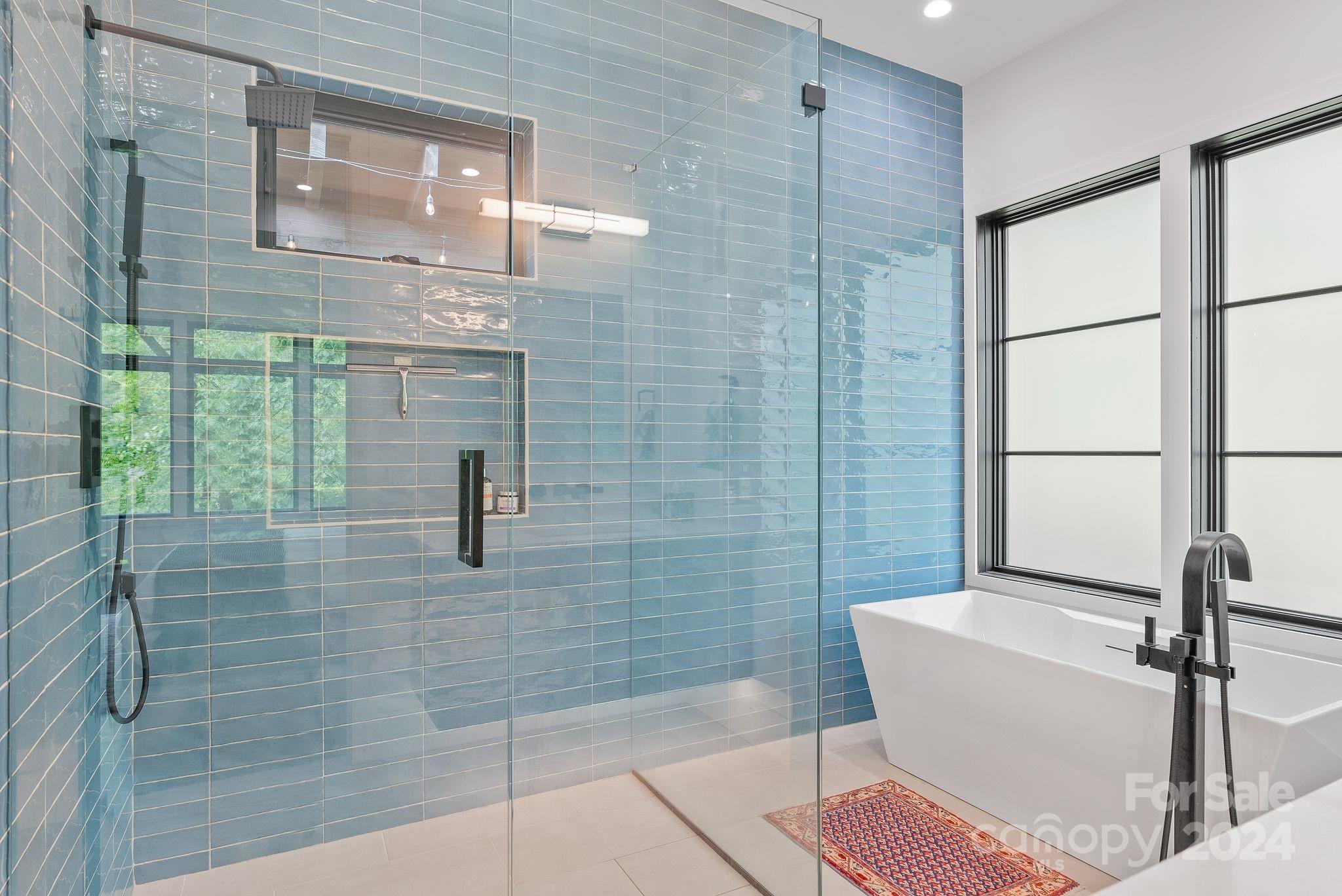 38 Brookwood Road Asheville, NC 28804 - Photo 31 of 45 a bathroom with a sink and shower