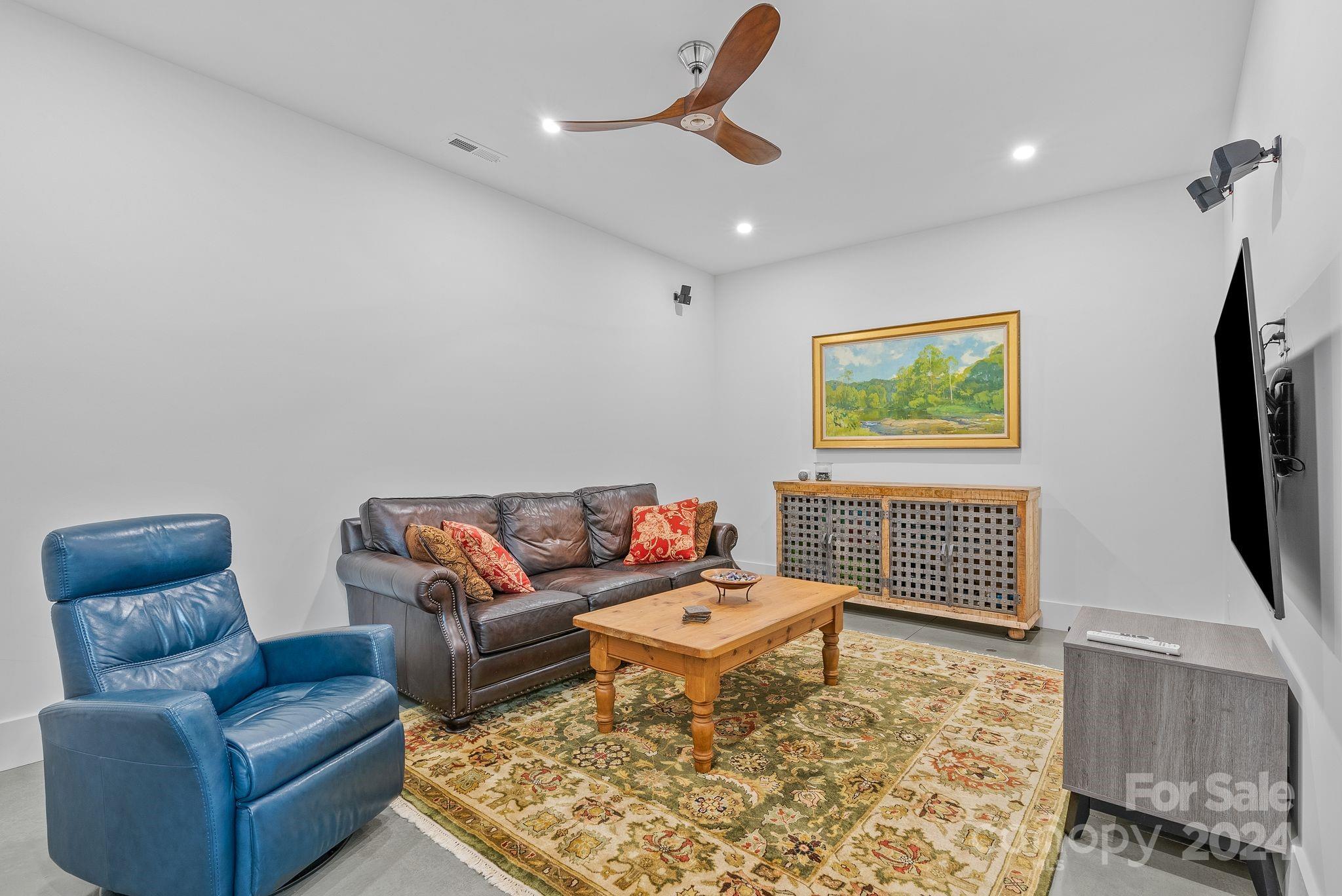 38 Brookwood Road Asheville, NC 28804 - Photo 36 of 45 a living room with furniture and a flat screen tv