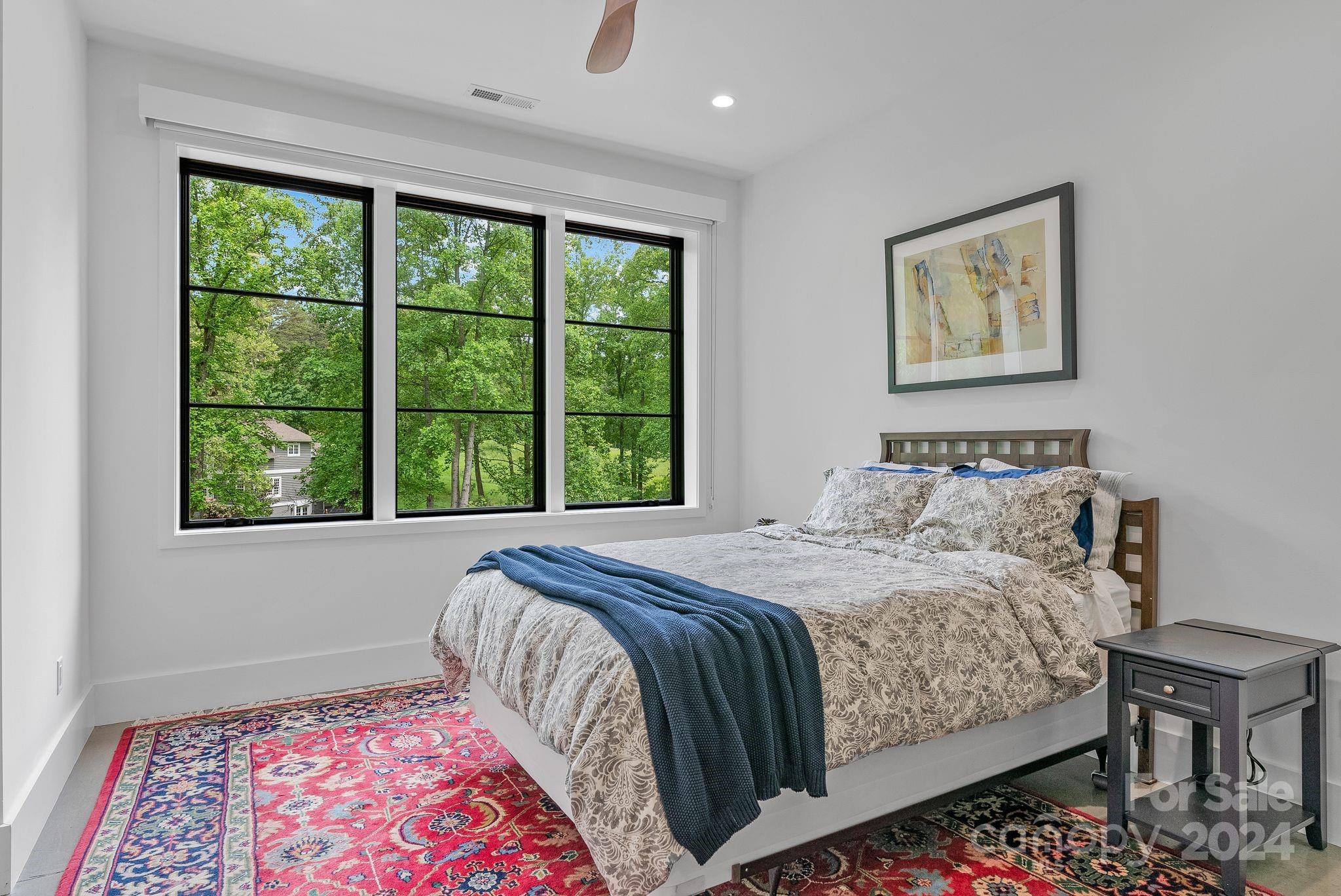 38 Brookwood Road Asheville, NC 28804 - Photo 38 of 45 a bedroom with a bed and a window
