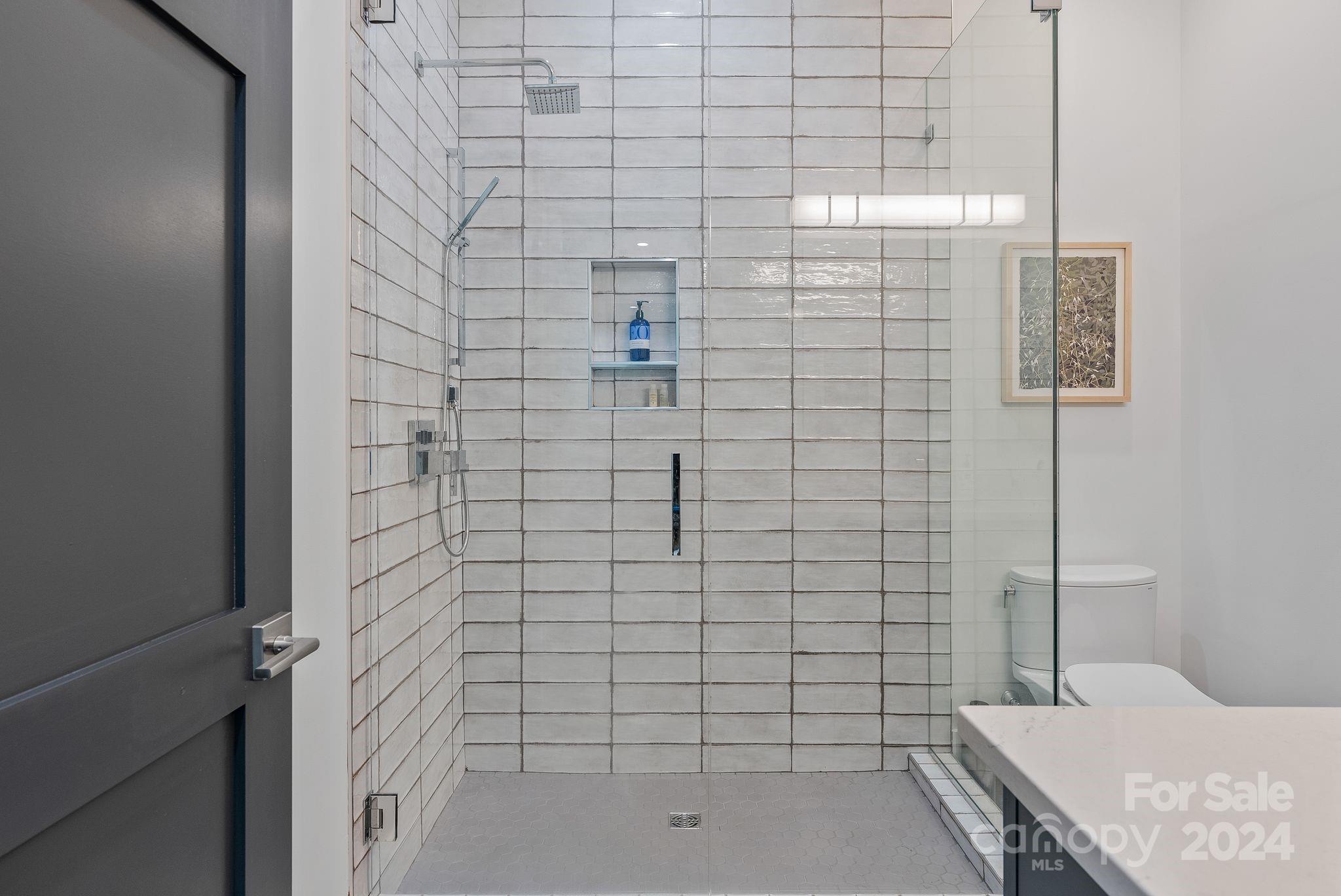 38 Brookwood Road Asheville, NC 28804 - Photo 39 of 45 a bathroom with a shower