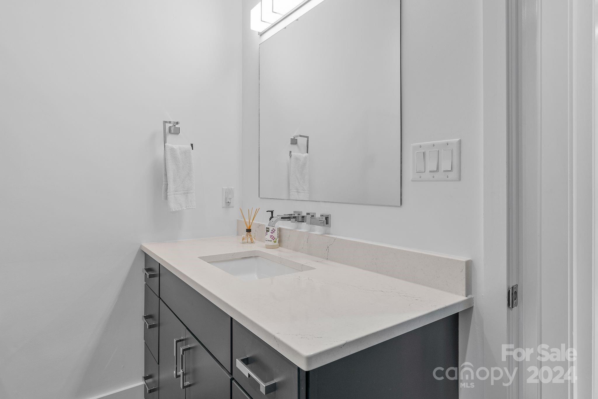38 Brookwood Road Asheville, NC 28804 - Photo 40 of 45 a bathroom with a sink and a mirror