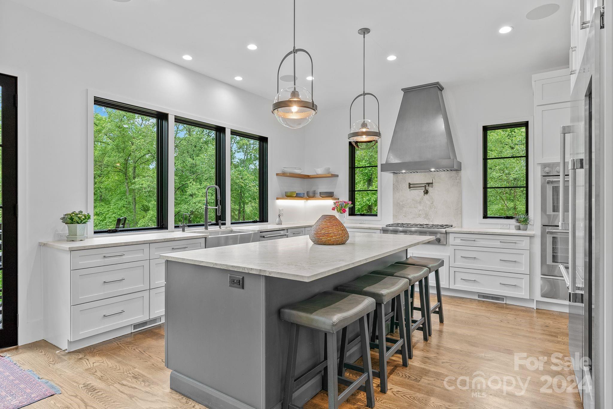 38 Brookwood Road Asheville, NC 28804 - Photo 4 of 45 a kitchen with a table chairs and a view of living room