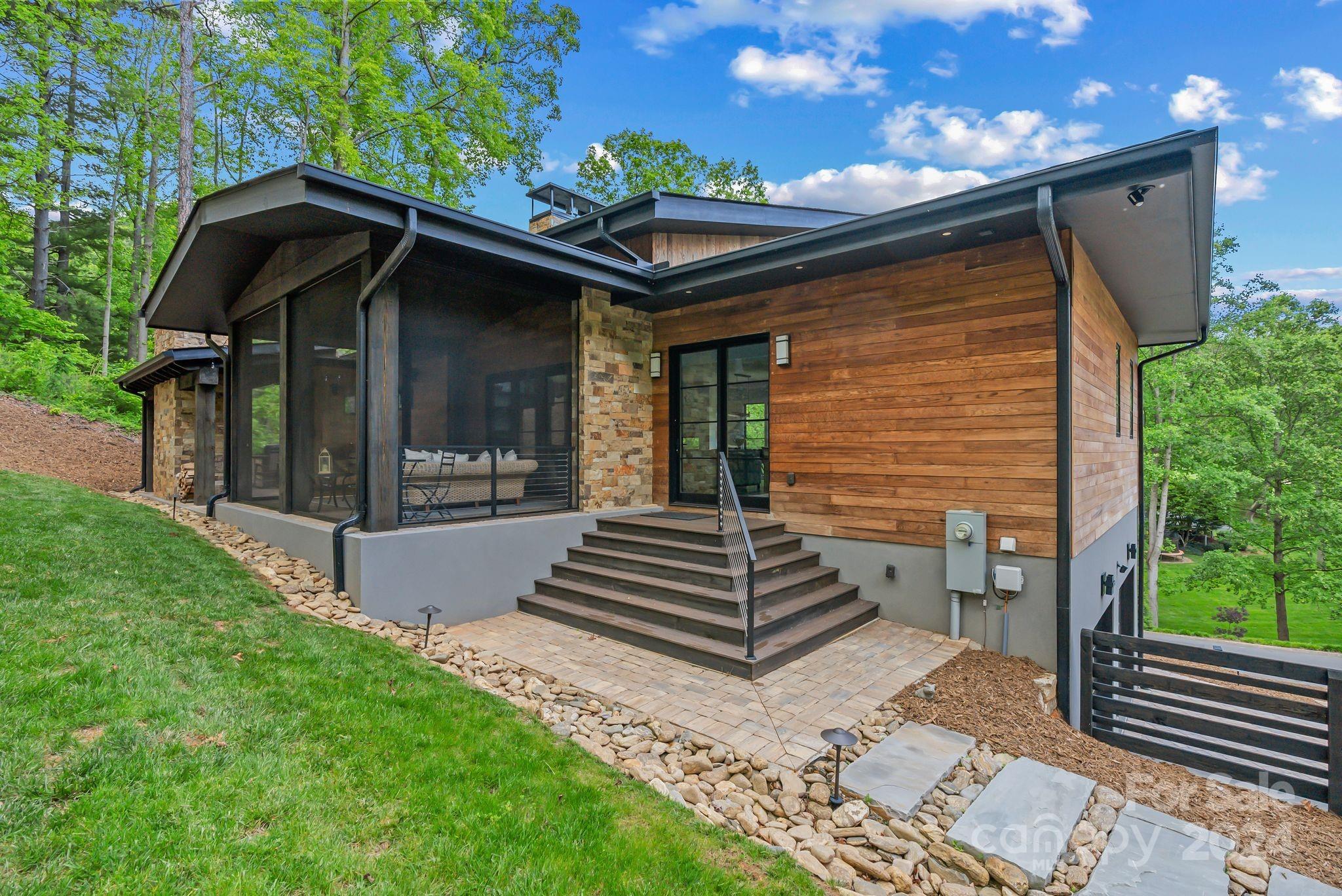 38 Brookwood Road Asheville, NC 28804 - Photo 45 of 45 a view of a house with backyard and porch