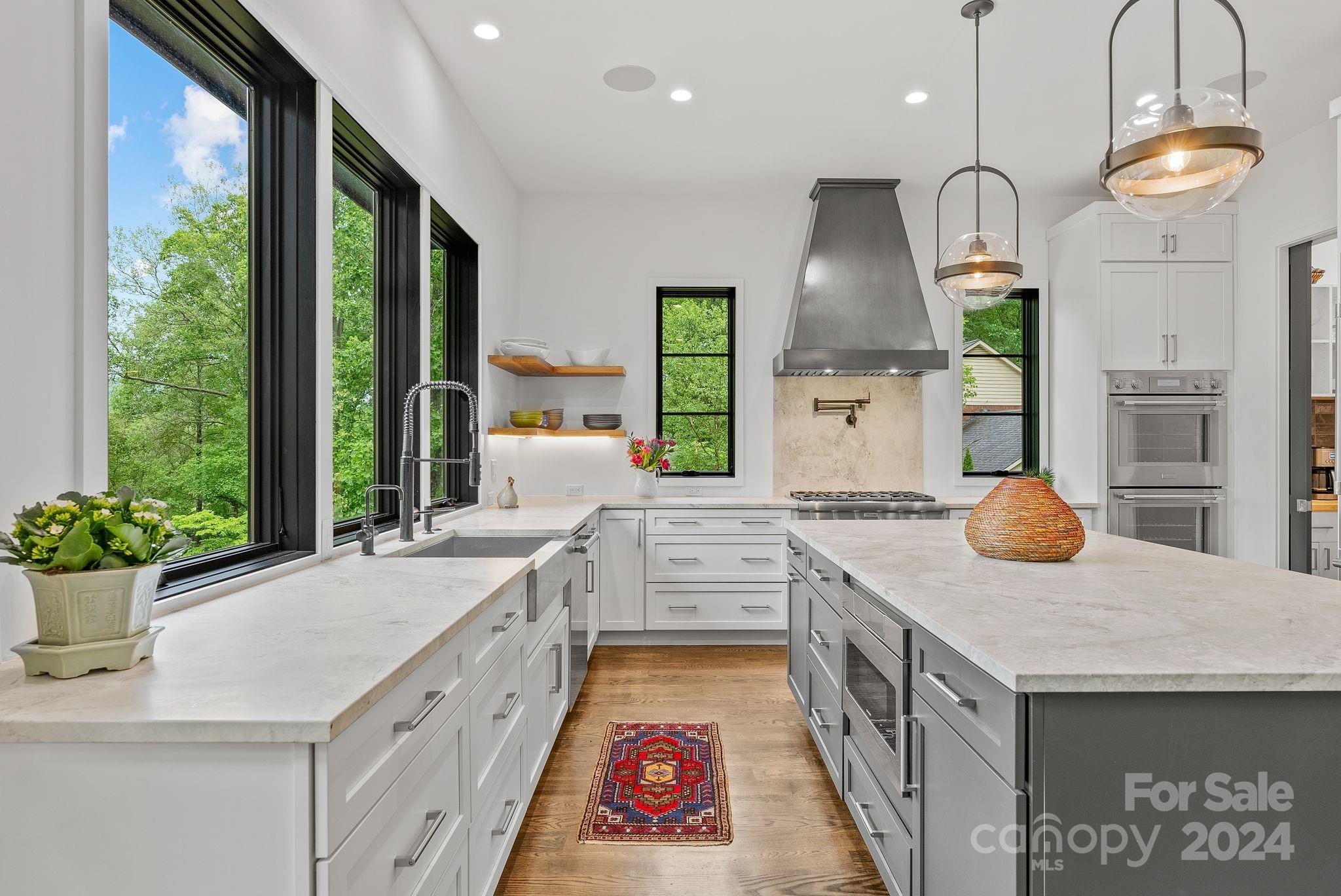 38 Brookwood Road Asheville, NC 28804 - Photo 6 of 45 a kitchen with sink stove and cabinets