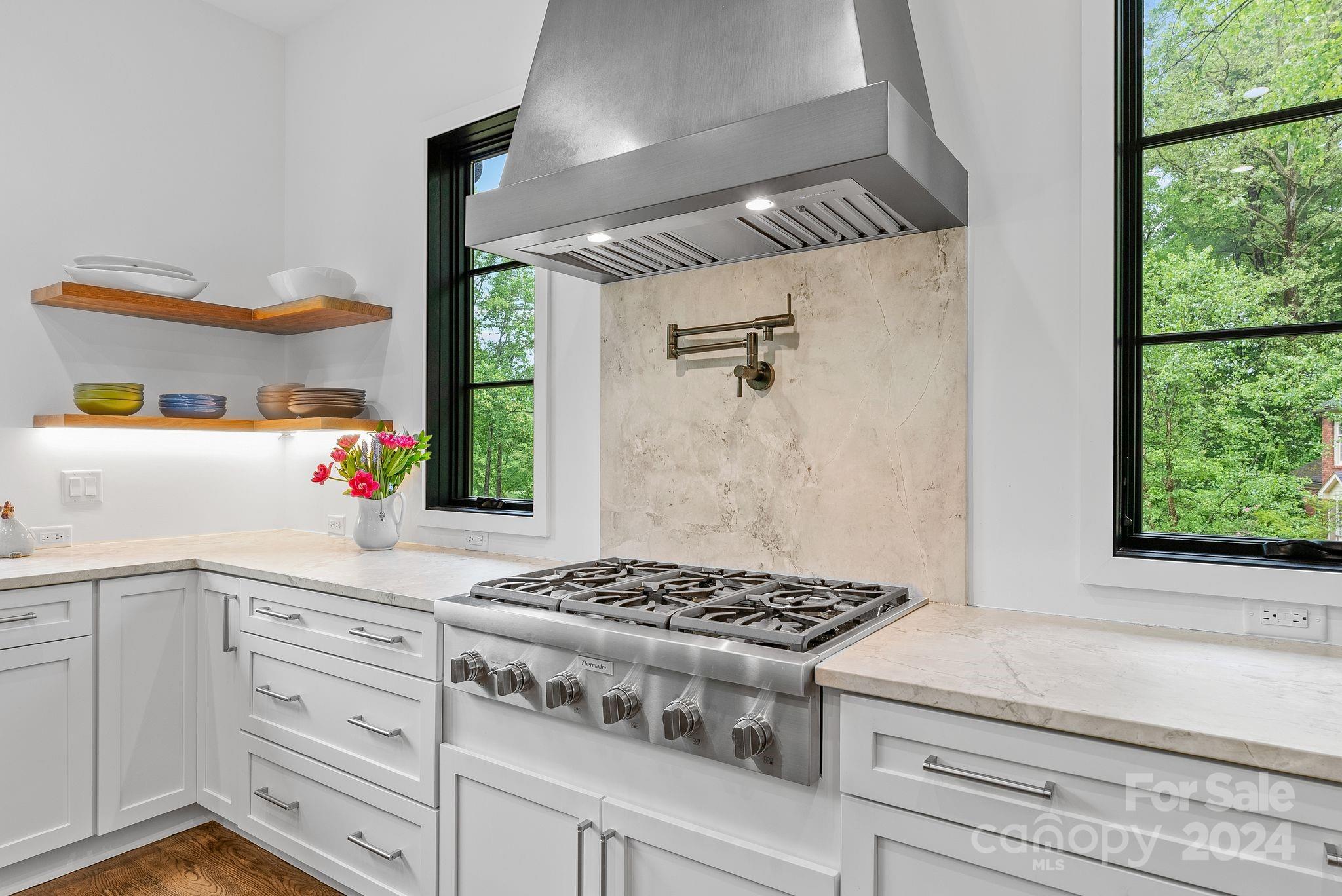 38 Brookwood Road Asheville, NC 28804 - Photo 7 of 45 a kitchen with a stove and a window