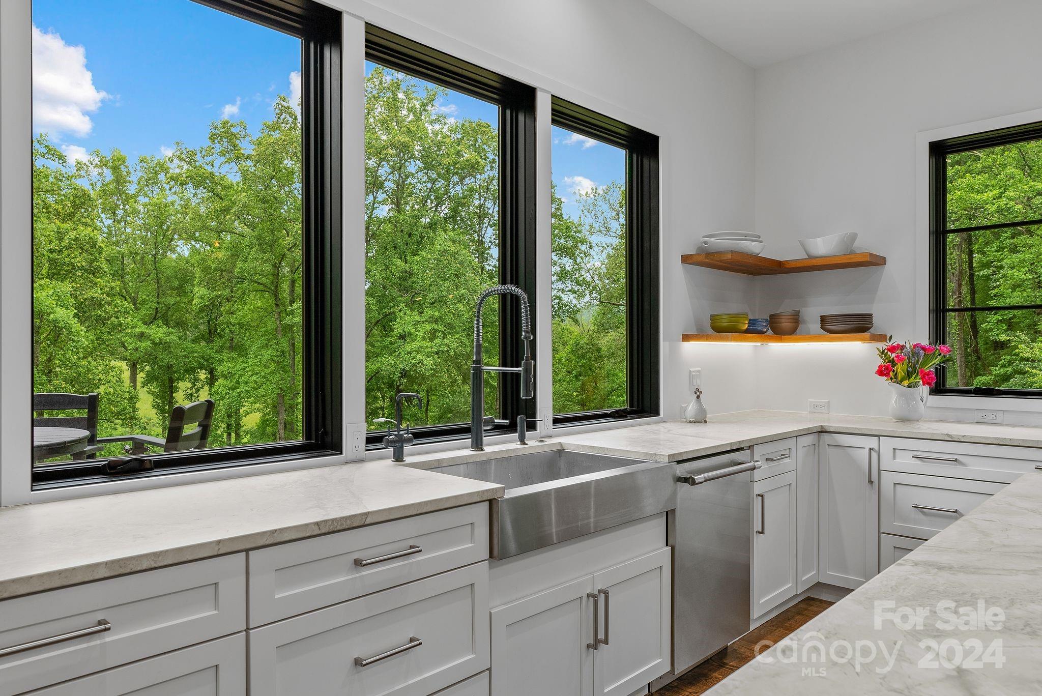 38 Brookwood Road Asheville, NC 28804 - Photo 9 of 45 a kitchen with a sink and large window