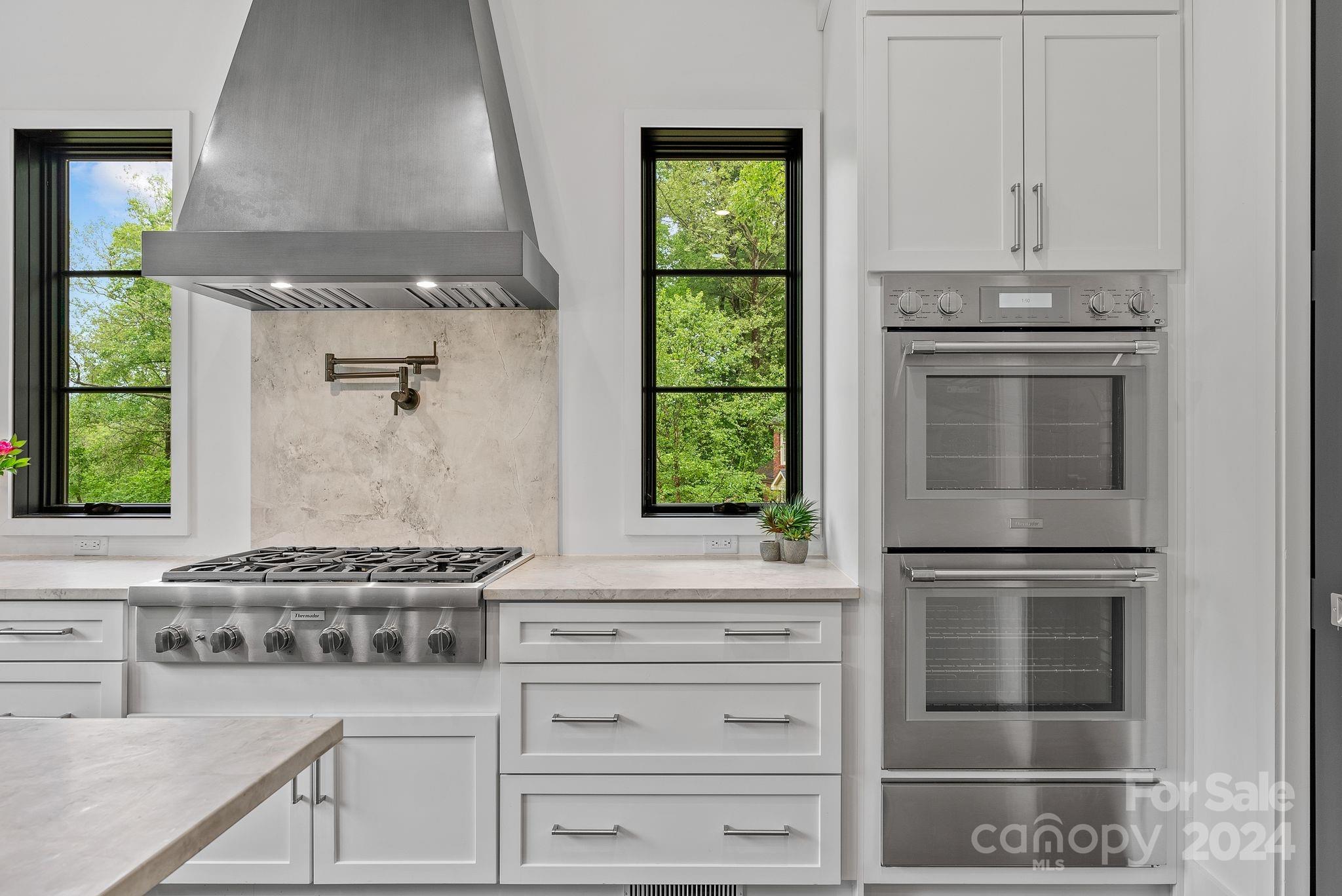 38 Brookwood Road Asheville, NC 28804 - Photo 10 of 45 a kitchen with granite countertop a stove and a sink