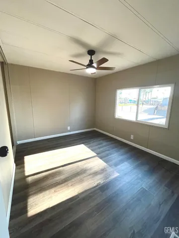 a bathroom with a double vanity sink mirror and bathtub