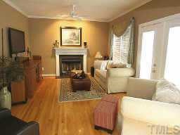 5809 Ventry Court Raleigh, NC 27613 - Photo 2 of 9 a living room with furniture and a fireplace