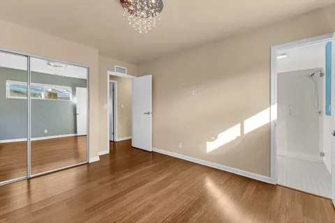 an empty room with wooden floor