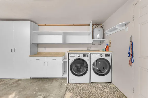a utility room with dryer and washer
