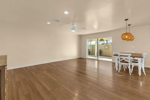 an open kitchen with table and chairs