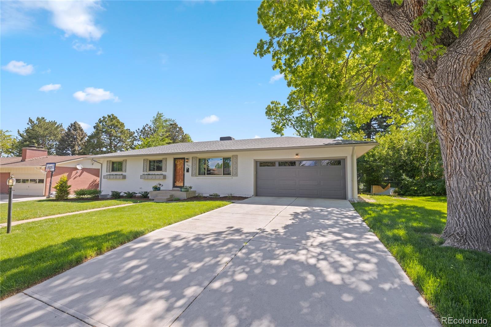 13402 West 24th Place Golden, CO 80401 - Photo 1 of 38 a front view of house with yard and green space