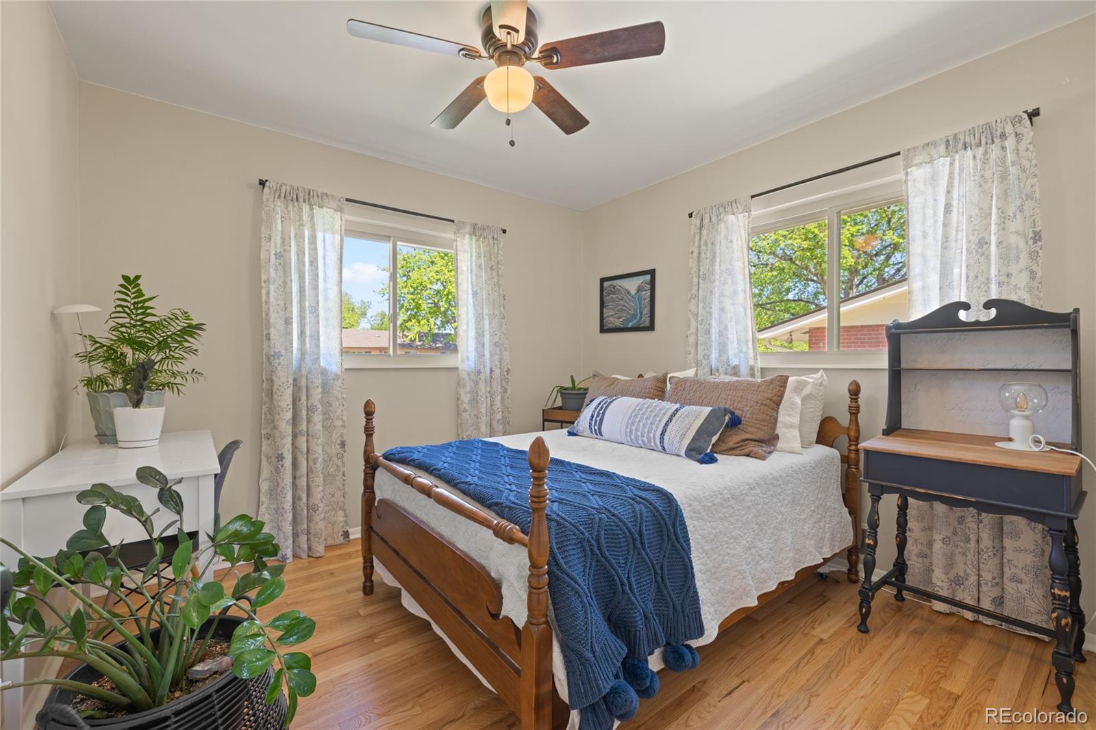 13402 West 24th Place Golden, CO 80401 - Photo 17 of 38 a bedroom with a bed and a potted plant