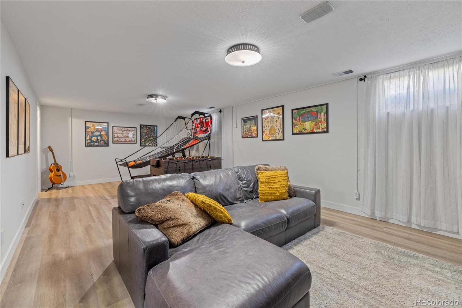 13402 West 24th Place Golden, CO 80401 - Photo 23 of 38 a living room with furniture and a couch