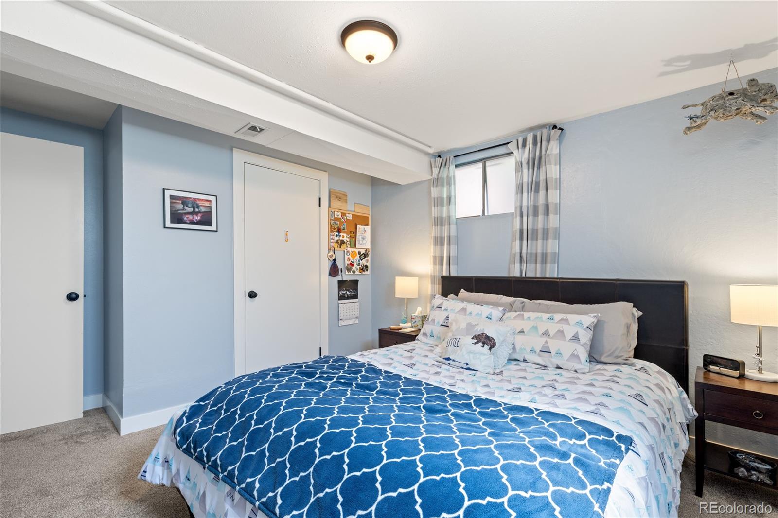 13402 West 24th Place Golden, CO 80401 - Photo 28 of 38 a bedroom with a large bed and a window