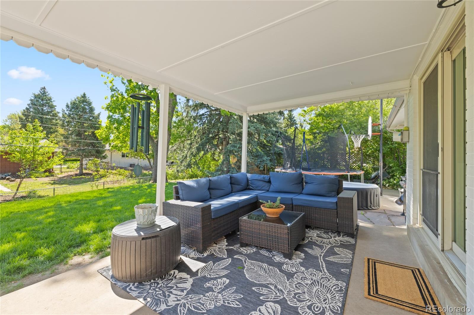 13402 West 24th Place Golden, CO 80401 - Photo 31 of 38 a outdoor living space with furniture and garden view