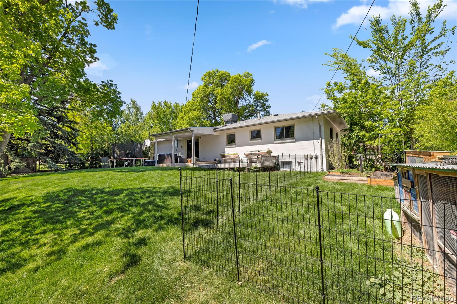 13402 West 24th Place Golden, CO 80401 - Photo 33 of 38 a front view of a house with a yard