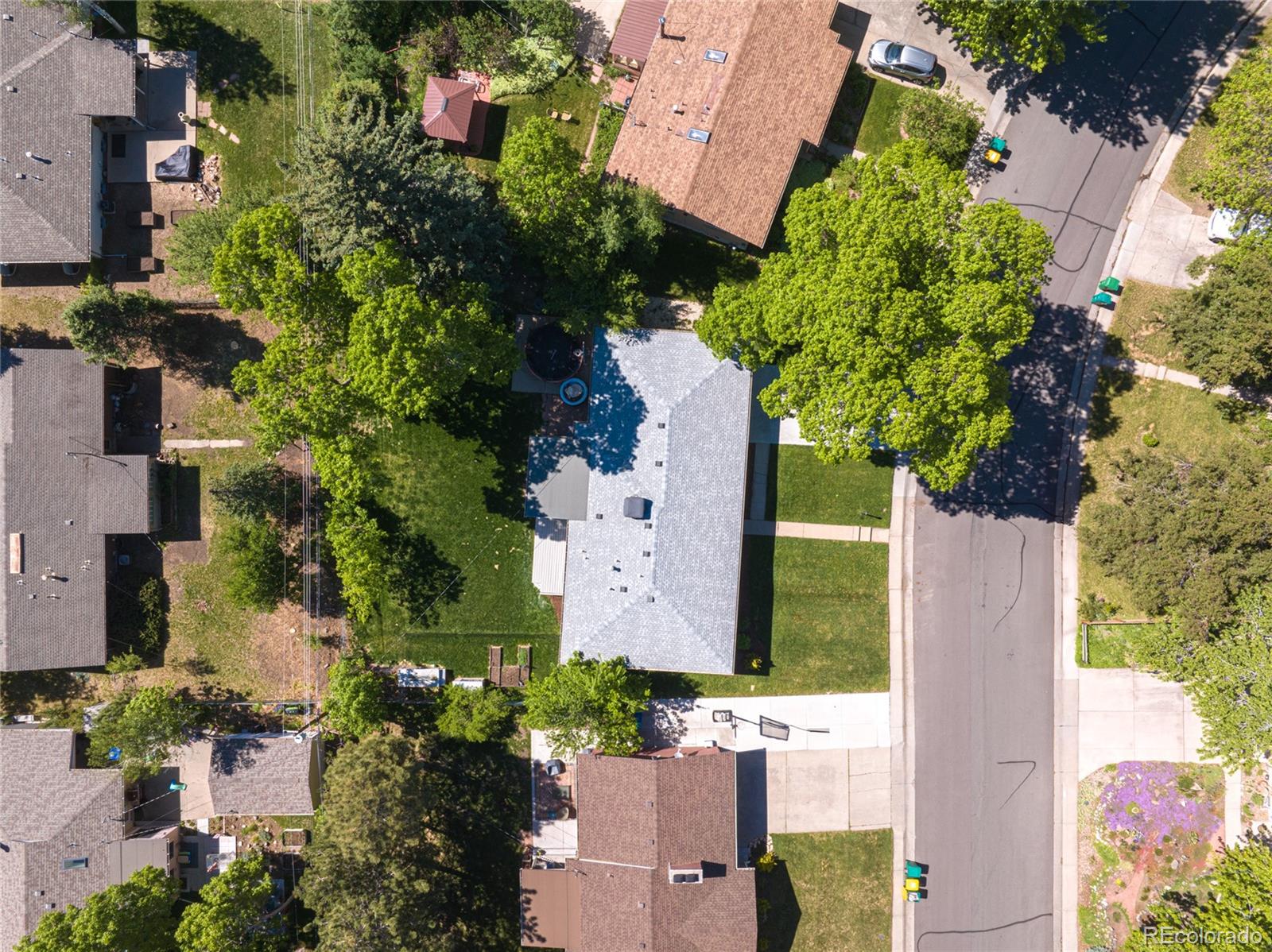 13402 West 24th Place Golden, CO 80401 - Photo 38 of 38 an aerial view of a house with a yard swimming pool and outdoor seating