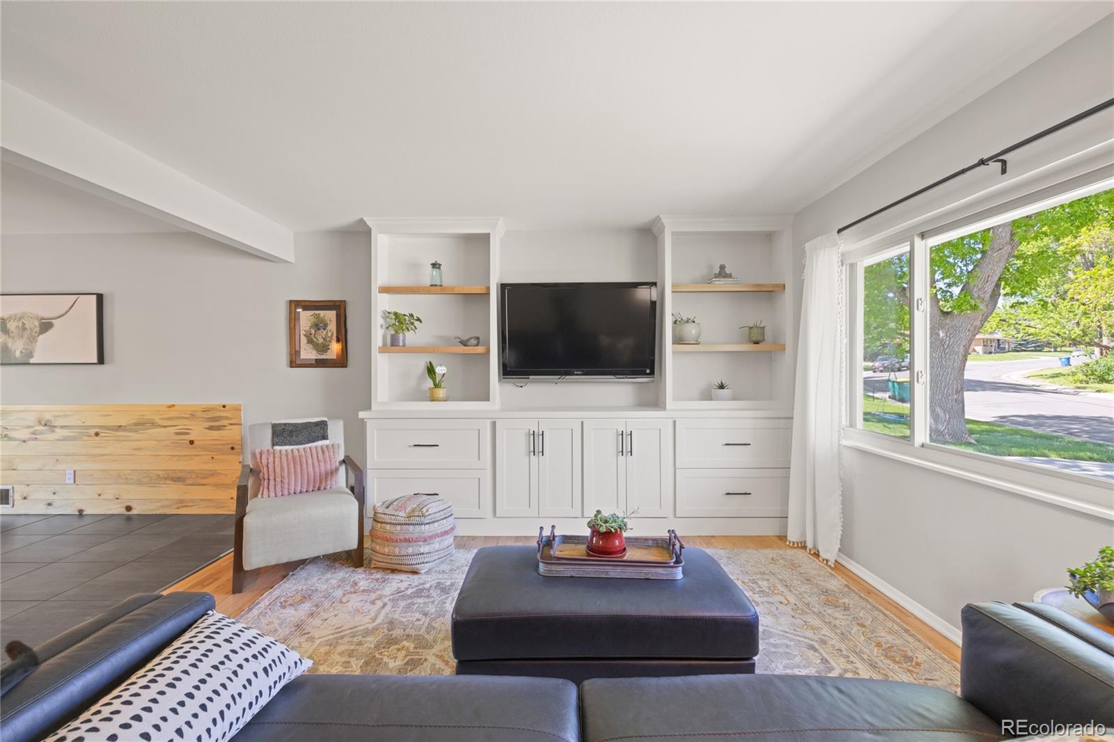 13402 West 24th Place Golden, CO 80401 - Photo 4 of 38 a living room with furniture and a flat screen tv