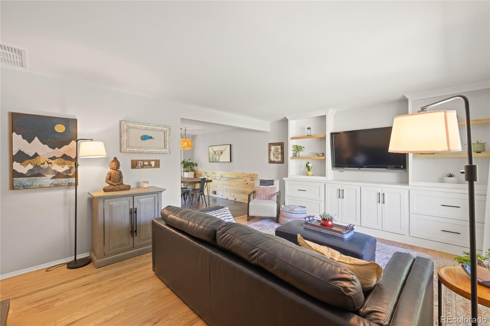 13402 West 24th Place Golden, CO 80401 - Photo 5 of 38 a living room with furniture and a flat screen tv