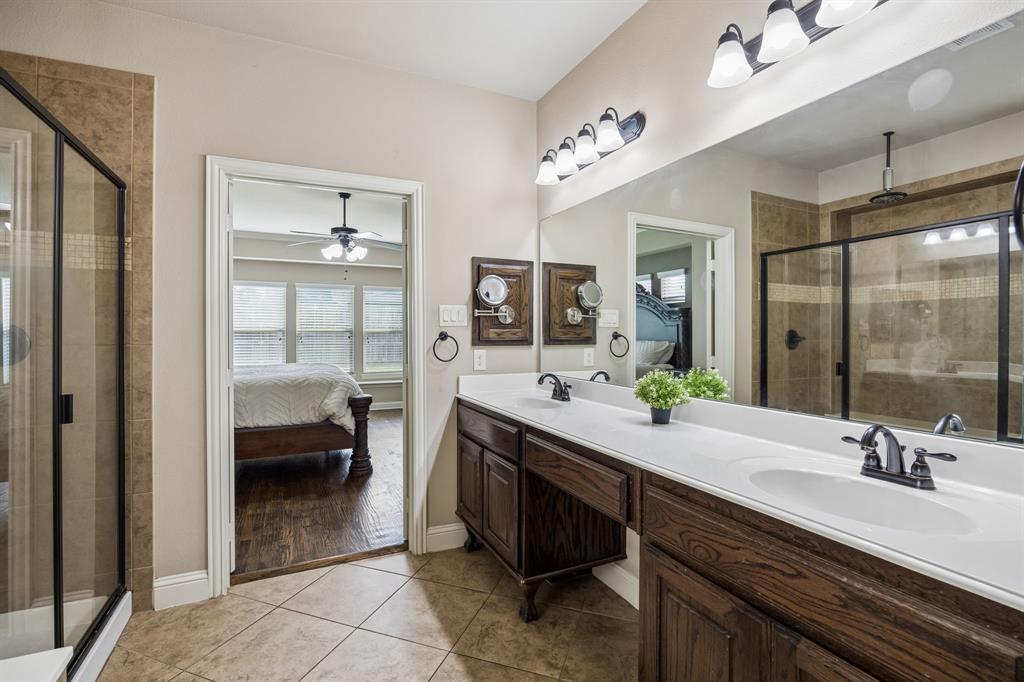 1014 Dunhill Lane Forney, TX 75126 - Photo 16 of 38 Another view of the primary bathroom looking into the bedroom.