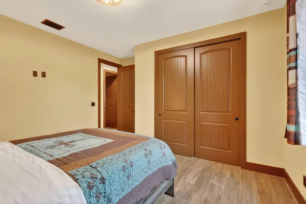 a bedroom with a bed and a dresser