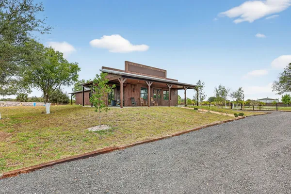 a front view of a house with a yard