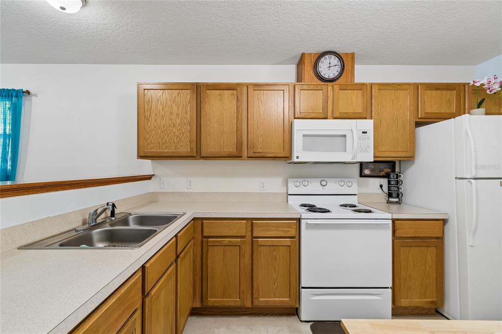 468 North Wheeler Avenue Inverness, FL 34453 - Photo 9 of 24 a kitchen with a sink cabinets and appliances