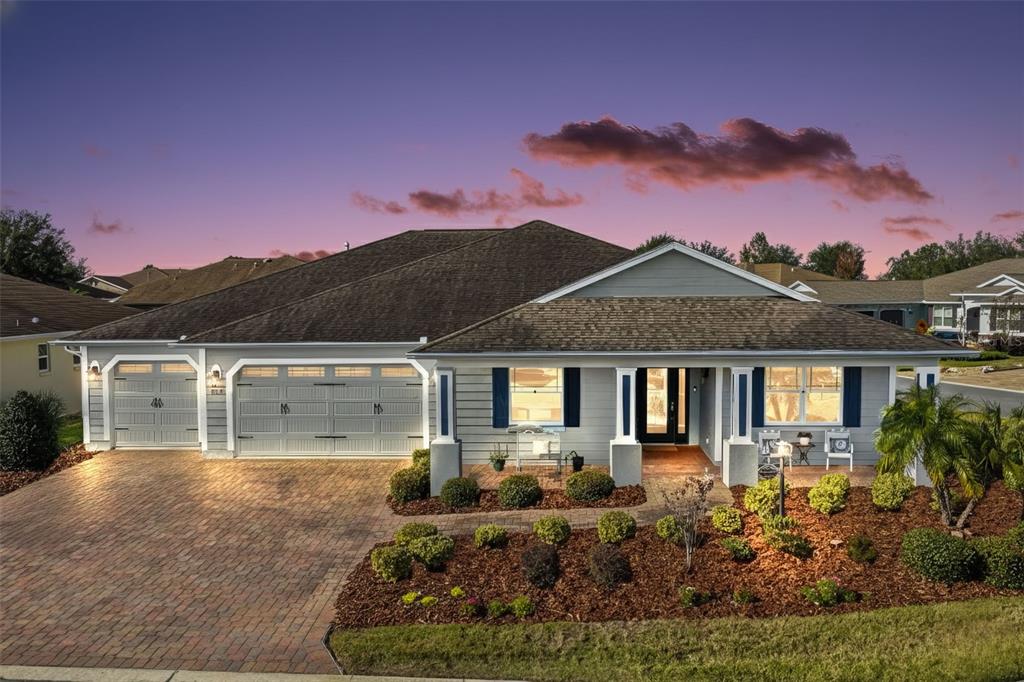 9630 Southwest 86th Place Ocala, FL 34481 - Photo 1 of 42 a front view of a house with a yard