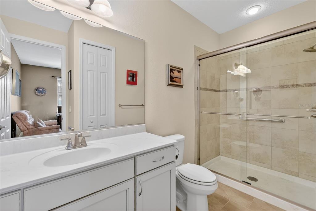 9630 Southwest 86th Place Ocala, FL 34481 - Photo 31 of 42 a bathroom with a sink toilet and shower