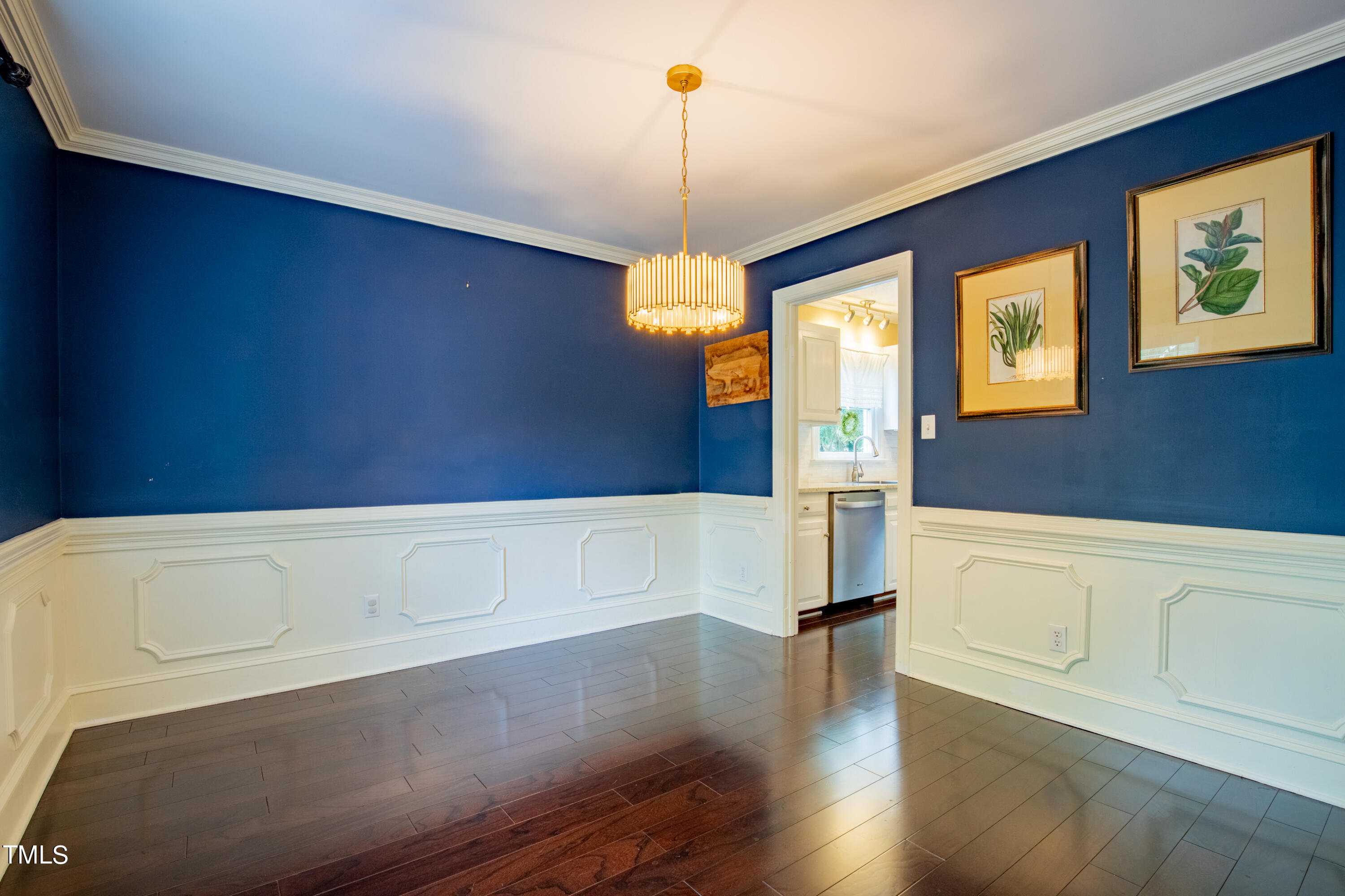 7012 Sandringham Drive Raleigh, NC 27613 - Photo 12 of 46 a view of empty room with wooden floor and window