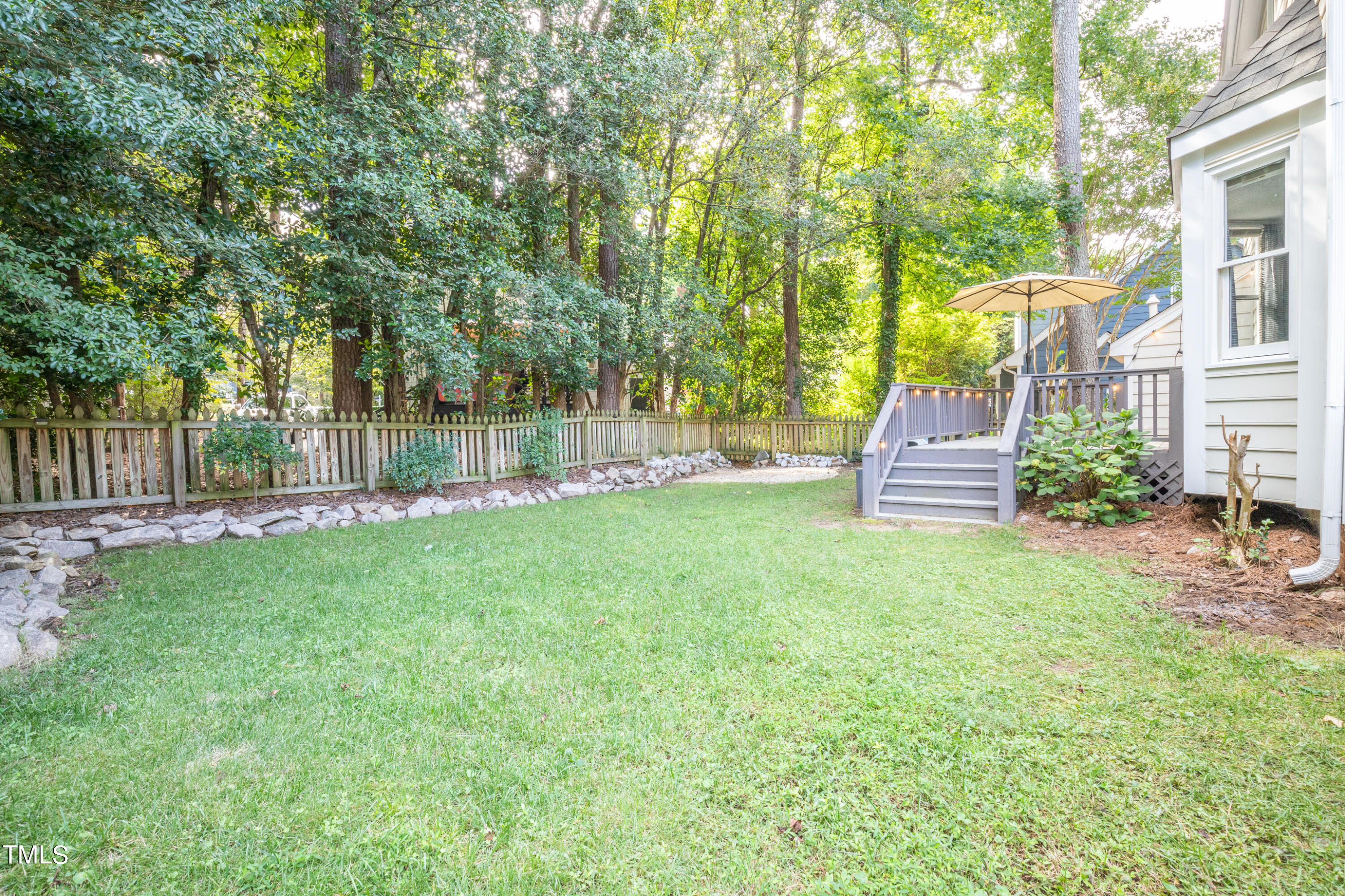 7012 Sandringham Drive Raleigh, NC 27613 - Photo 26 of 46 a view of a house with backyard and sitting area