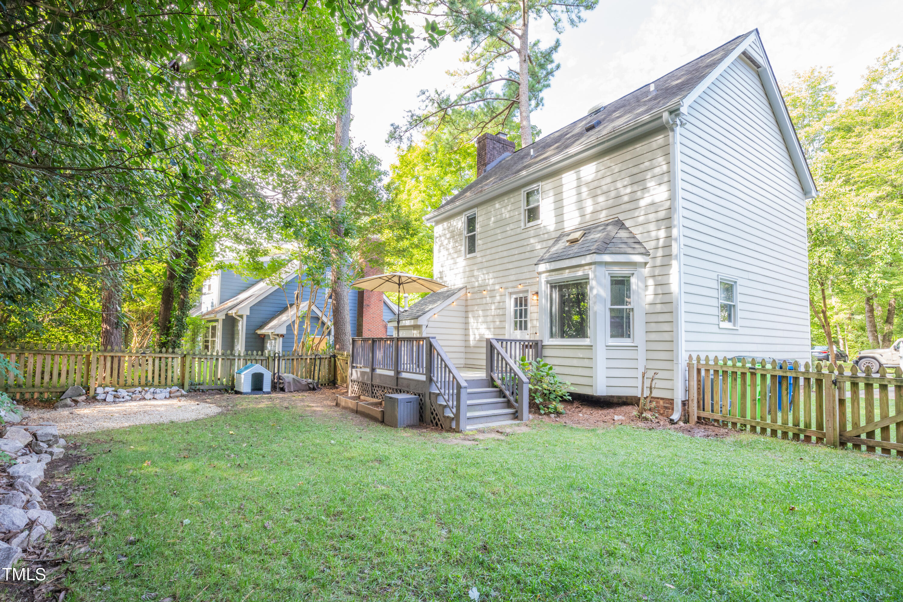 7012 Sandringham Drive Raleigh, NC 27613 - Photo 27 of 46 a view of a house with a yard