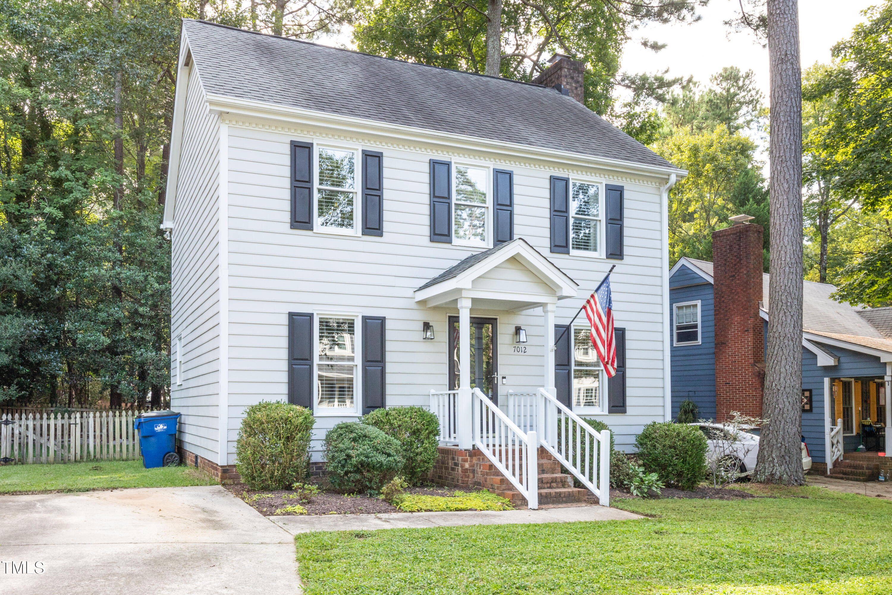 7012 Sandringham Drive Raleigh, NC 27613 - Photo 3 of 46 a front view of a house with a yard
